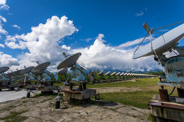 satellite dishes on a background of mountains
badars