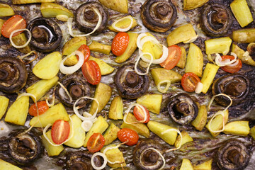 baked mushrooms champignons with potatoes and tomatoes