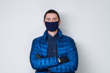 Man wearing a protective mask to prevent the spread of Coronavirus.