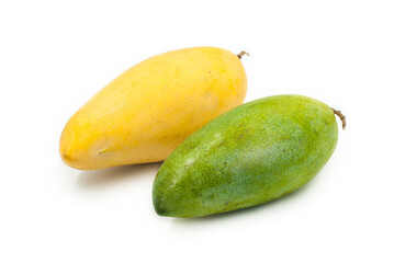 Raw mangoes and ripe mangoes on a white background