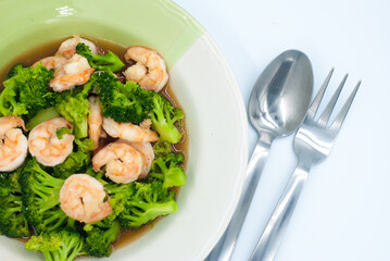 Broccoli stir-fried with shrimp on a white background