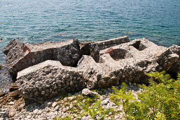 The ruins of the old city wall collapsed into the sea