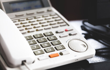 Inter office communication business telephone system, land line phone on the desk, number pad...