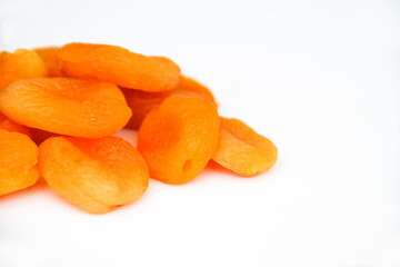 Pile of dried apricots on a white background. Back view.