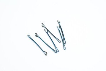 Black hair clips on a white background