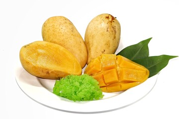 Mango sticky rice on a white plate, placed on a white background