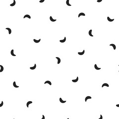 Seamless abstract pattern of little black shabby strokes or spots on white. Hand drawn, offhand style.