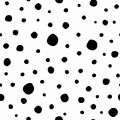 Seamless abstract pattern of little black shabby dots or spots on white.