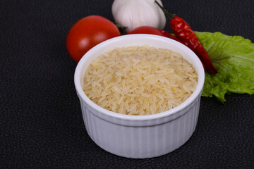 Raw uncooked rice in the bowl