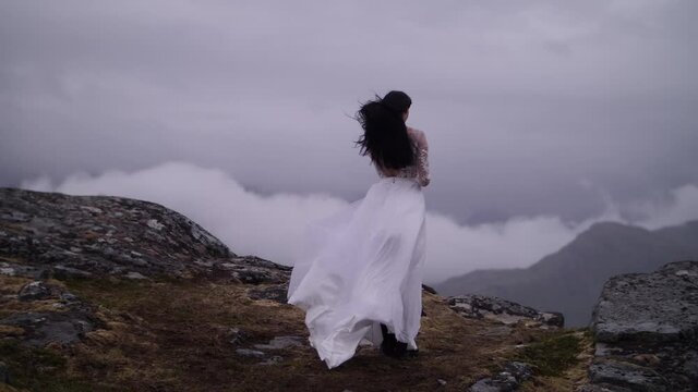 girl in a dress on a background of mountains girl with black hair
