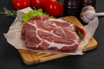 Raw pork neck steak