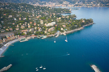 A view above on a seashore of Santa Margherita Ligure, Italy. White boats and yachts on foreground.