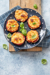 Baked eggplant with parmesan cheese, tomatoes and basil