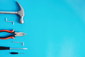 Tools for repair on a blue background.