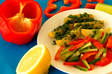 Useful lunch. Stewed potatoes with herbs and vegetable salad. Close-up..