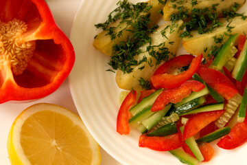 Useful afternoon snack. Steamed potatoes with a salad of fresh vegetables..