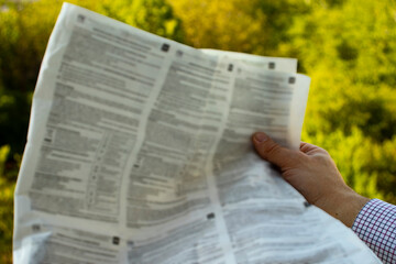 Close-up shot of a businessman reading the latest news
