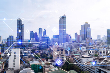 Fototapeta na wymiar Technology hologram over panorama city view of Bangkok. The largest tech hub in Asia. The concept of developing coding and high-tech science. Double exposure.