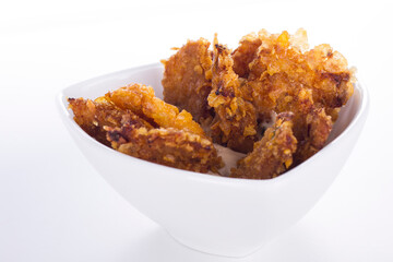 Small chicken nuggets for a party in a white bowl