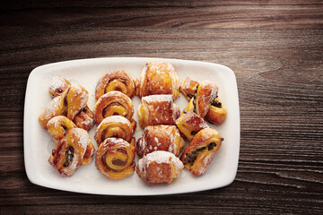 Mixed breakfast pastries served in a white tray