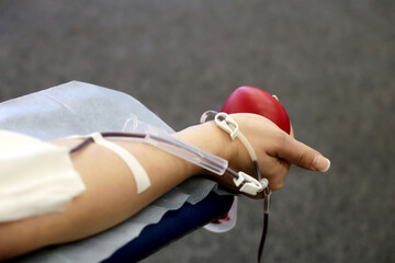 World blood donor day concept, donorship and health care. Woman in chair during transfusion with...