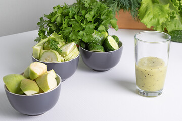 fruit  vegetable smoothie and ingredients  on  white table. Diet drink