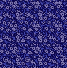 Vintage floral background. Seamless vector pattern for design and fashion prints. Flowers pattern with small lilac flowers on a dark blue background. Ditsy style.