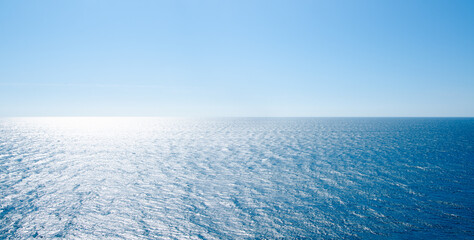 Naklejka na ściany i meble Panoramic seascape vivid blue sea with waves and clear sky