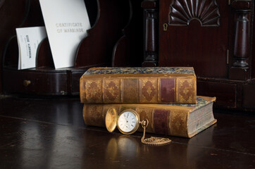 Antique wood desk containing genealogy land deeds and certificate of marriage, pocket watch and old...