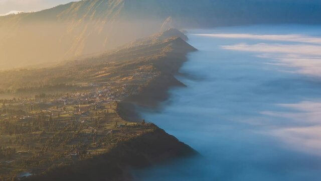 Beautiful Cliff Side Village Sunlight and Misty, Landmark Travel Place of East Java, Indonesia (zoom in)