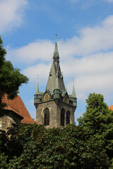 Clock at the tower of the church. Religious gothic building.