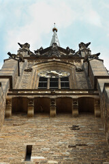 Clock at the tower of the church. Religious gothic building.