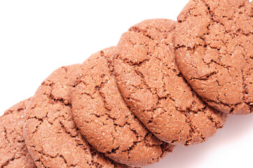 beautiful cookie of shekoladnogo color stands diagonally on a white sheet