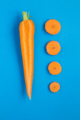 Chopped carrot  on the blue  background. Top view. Location vertical.Flat lay.