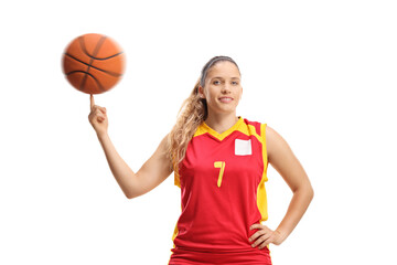Woman basketball player spinning a ball with a finger
