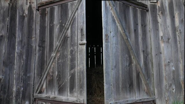 Wooden gates open. Hayloft