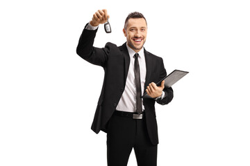 Smiling man in a suit showing a car key