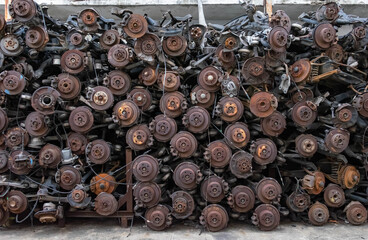 Old rusty brake disc background .Old car parts laid in a stack.