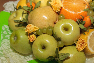 Fruit and floral green bouquet with apples and citrus