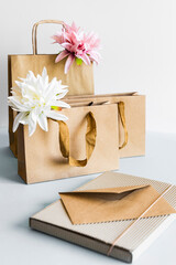 Zero waste concept, kraft brown paper bags and envelope on light background. 