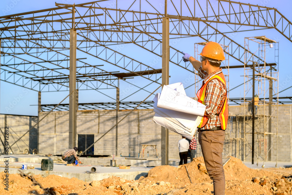 Poster engineer technician watching team of workers on high steel platform, engineer technician looking up 