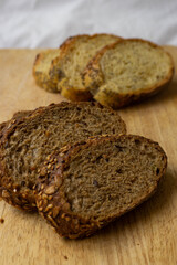 Bread slices on a wooden table. Integral brads. Corn bread. Selective focus.
