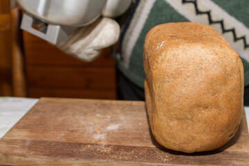 Freshly baked bread was baked at home in a bread maker