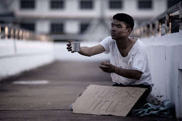 The poor man begs alms, homeless Asian man is begging for money