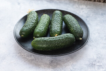 Tasty and healthy, ripe cucumbers on a plate