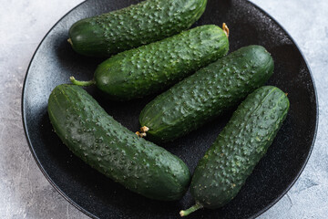 Tasty and healthy, ripe cucumbers on a plate