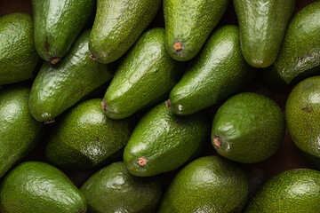 A lot of avocado close up. Healthy and tasty food. Exotic fruit