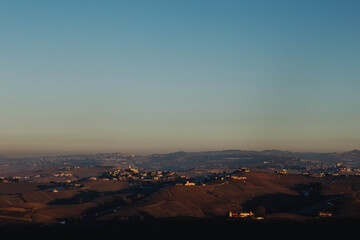 Beautiful Landscape of the  hills and vineyards  at sunset  around Barolo Village, famous for the  fine wine, The Langhe area, Piedmont Italy.