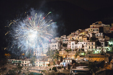 Spectacular fireworks illuminate the  village of Albori during New Year's Eve, Amalfi Coast, south of Italy, Europe.