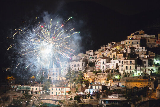 Spectacular fireworks illuminate the  village of Albori during New Year's Eve, Amalfi Coast, south of Italy, Europe.